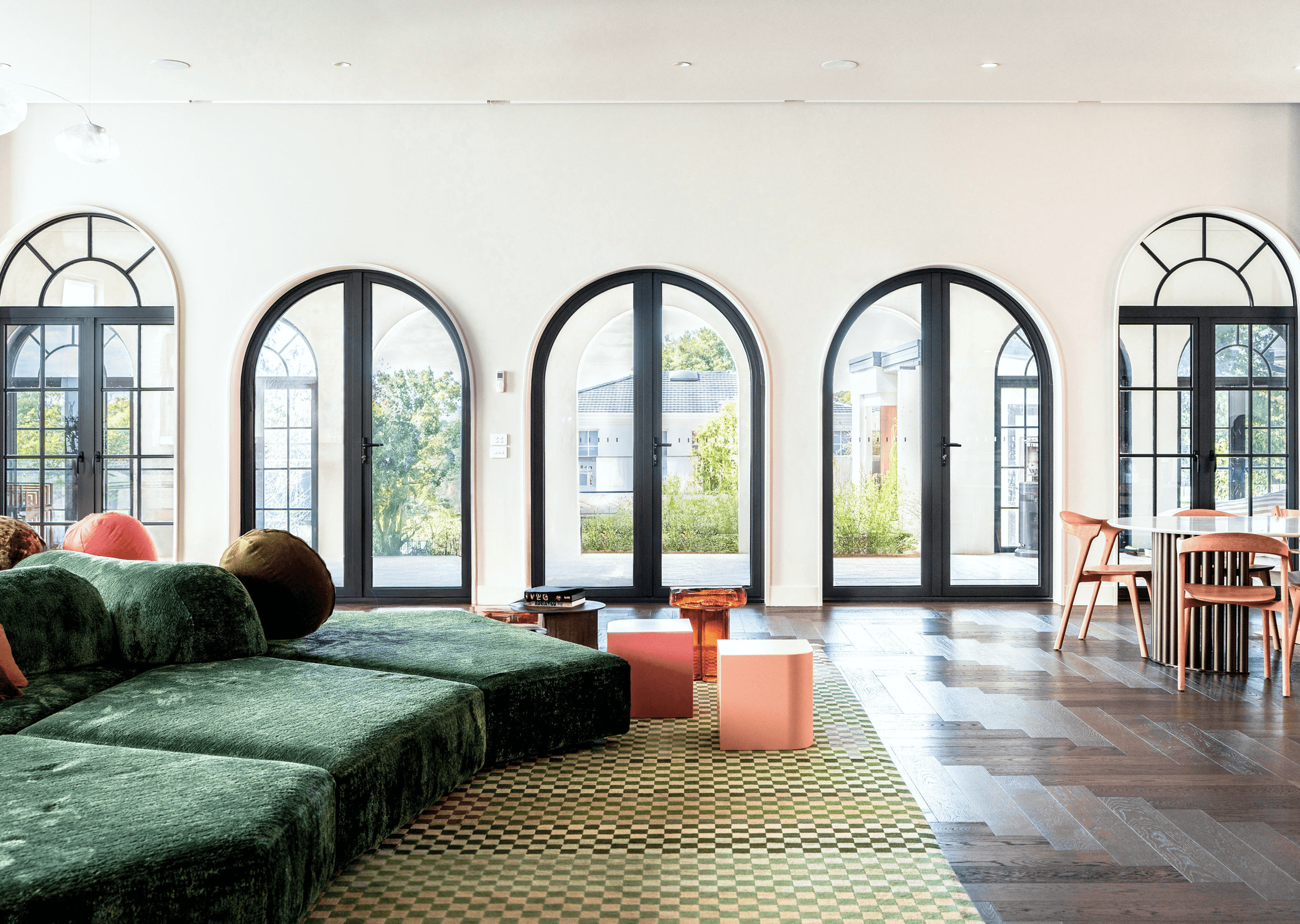 Manoir Series — living room lined with arched French doors