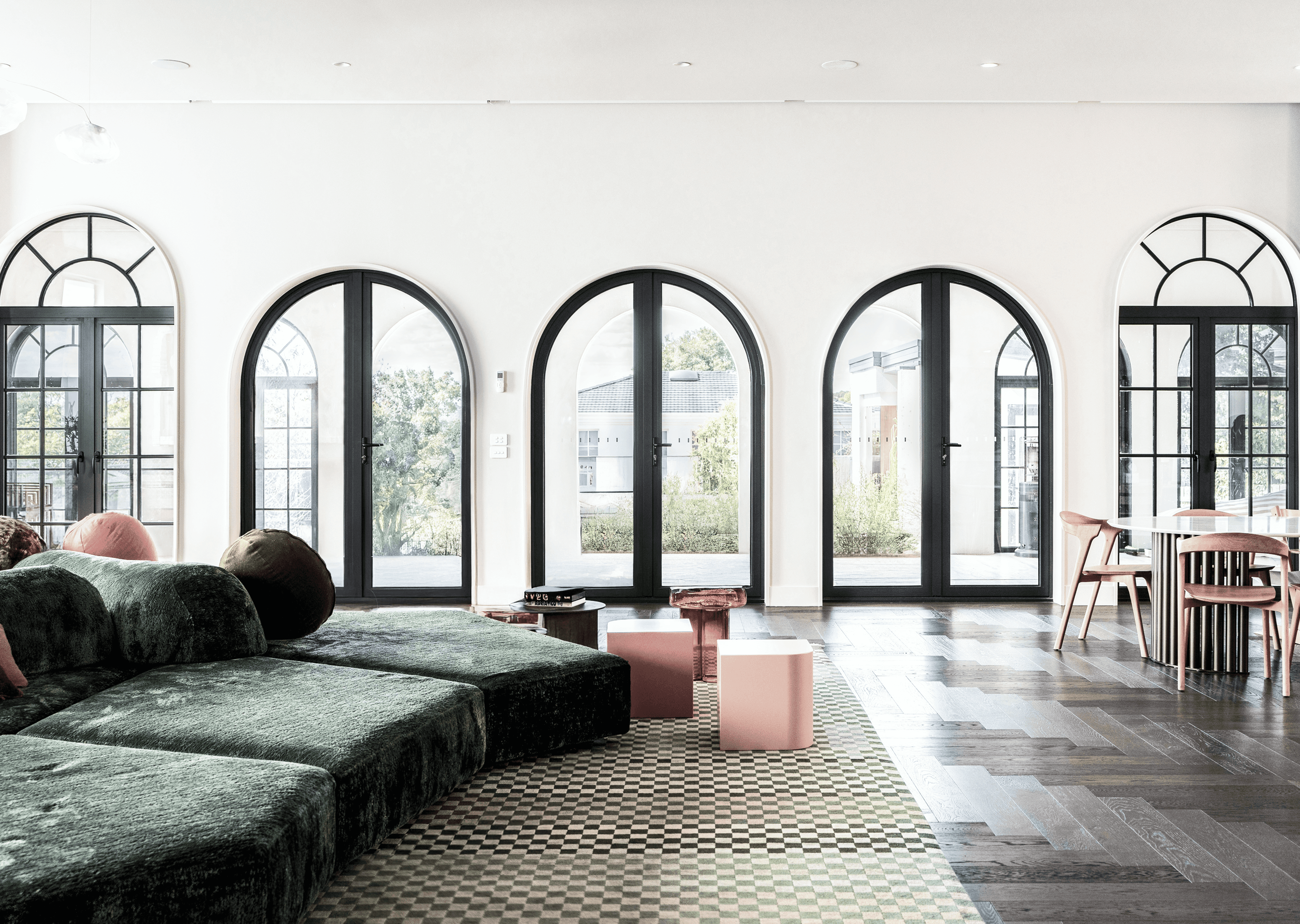 Manoir Series — living room lined with arched French doors